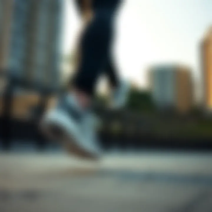 Person wearing adidas Astir Gri shoes while jogging in a urban setting