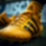 Close-up view of Adidas leather soccer cleats showcasing intricate stitching and design