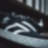 A close-up view of the adidas Samba women's black sports shoe showcasing its distinct design elements.