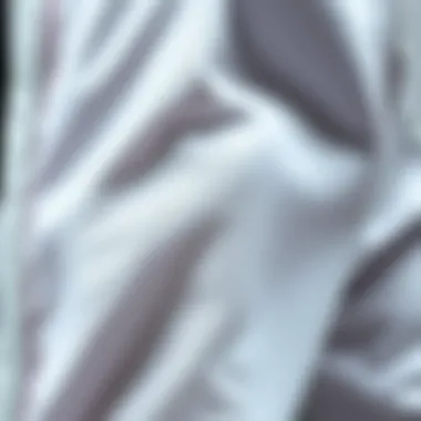 Close-up of the fabric texture of Adidas white sweatpants, highlighting quality.