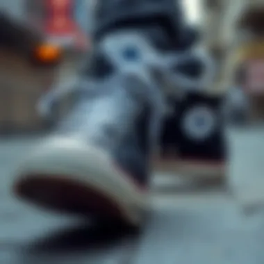 Close-up of Converse high-top shoes on urban setting