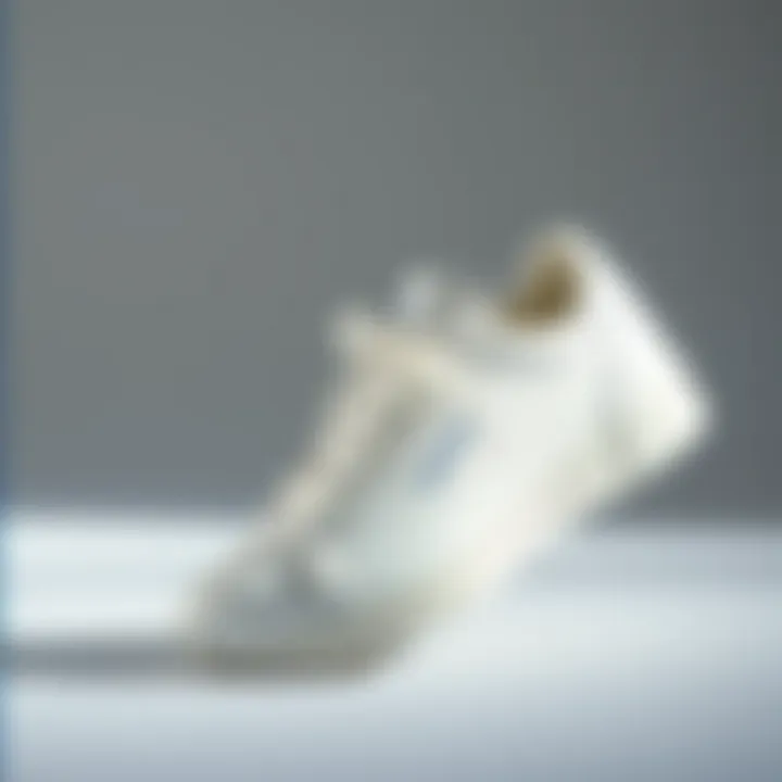 Elegant white Hummel sneakers displayed on a minimalist background
