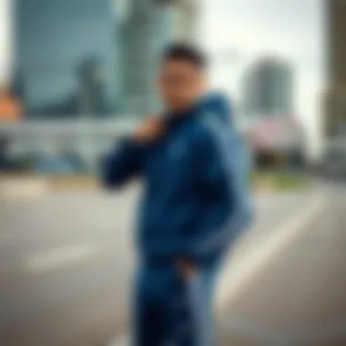 Athletic individual showcasing a blue tracksuit in an urban setting