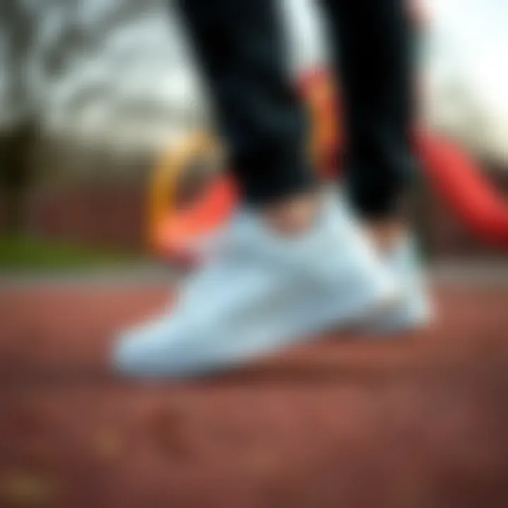 Stylish Nike kids' white sports shoes on a playground